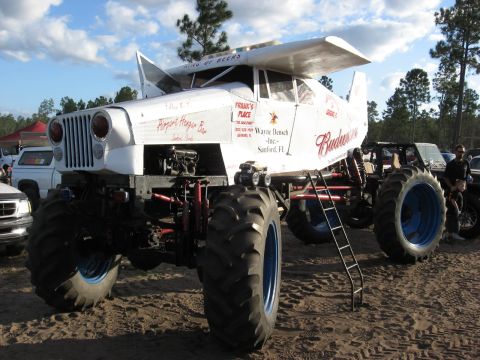 1994 Ford Bronco - This heavily modified vehicle features airplane wings and prominent Budweiser branding.