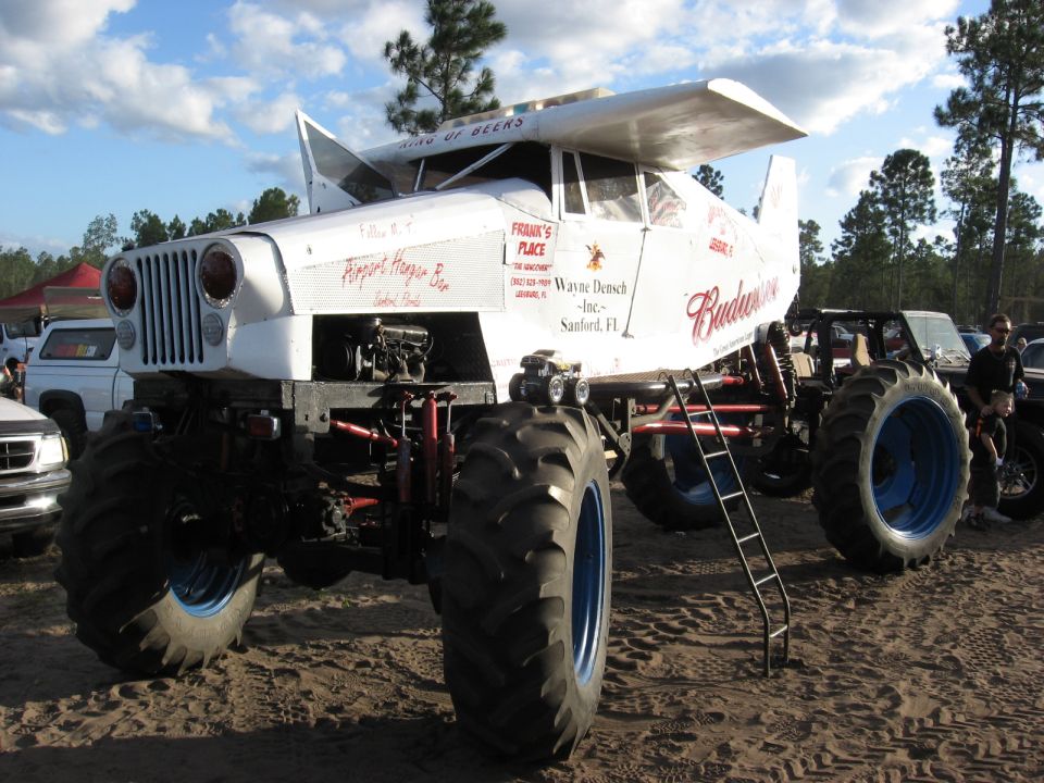 Monster truck with airplane wings, Budweiser logos, and large tires