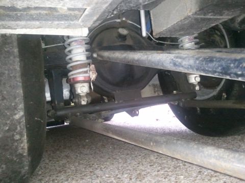1967 Ford Mustang - This photo shows the rear axle and suspension of a vehicle, including shocks and springs.