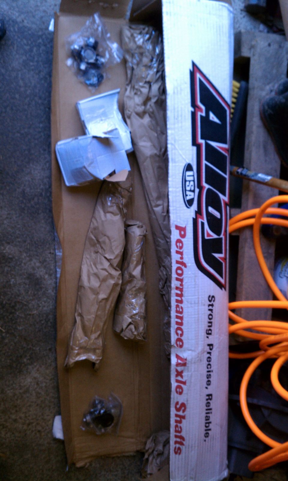 Box of Alloy Performance Axle Shafts with some hardware