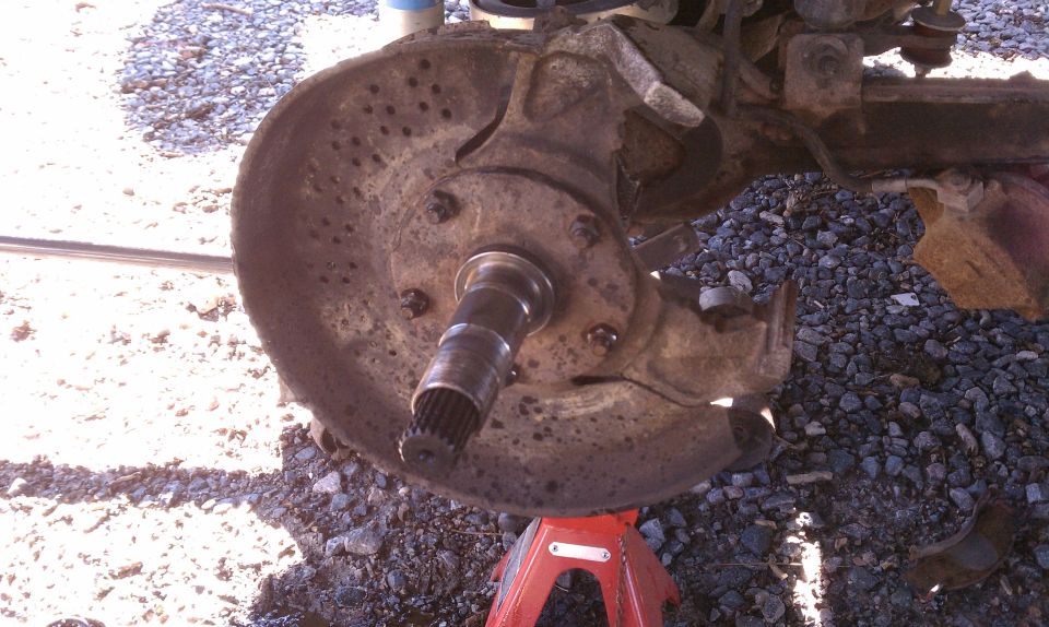 Rusted brake rotor and hub assembly on axle