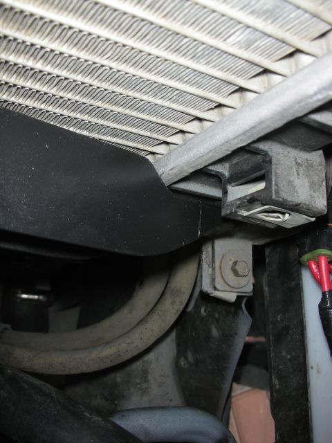 2004 Ford Crown Victoria - Close-up view of radiator and associated hoses, likely from a vehicle's engine bay.