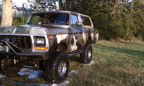 1979 Ford Bronco - This lifted Ford Bronco is painted in a camouflage pattern and sits on large off-road tires.