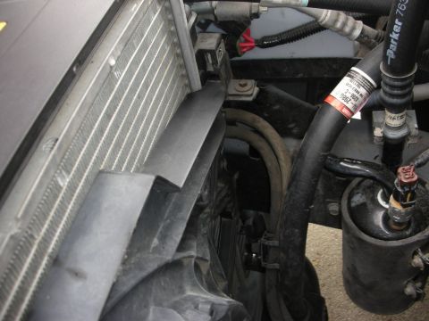 2004 Ford Crown Victoria - Close-up view of engine bay components, including the radiator and fan assembly.