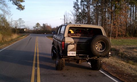 1979 Ford Bronco - This Ford Bronco, likely a 1978 model, is seen from the rear on a rural road.