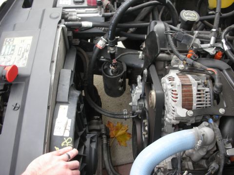 2004 Ford Crown Victoria - Close-up view of a vehicle's engine compartment, showing various components and hoses.