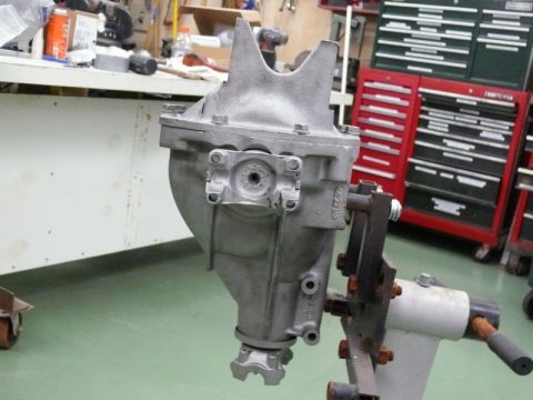 1976 Chevrolet Corvette - A differential part is shown mounted on a stand in a workshop setting.