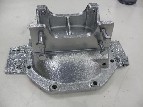 1976 Chevrolet Corvette - A freshly painted differential cover sits on a surface, ready for installation.
