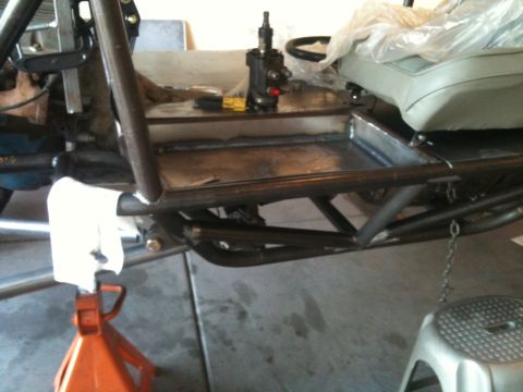 1966 Ford Bronco - Custom buggy frame with steering and seating components visible, undergoing construction or repair.