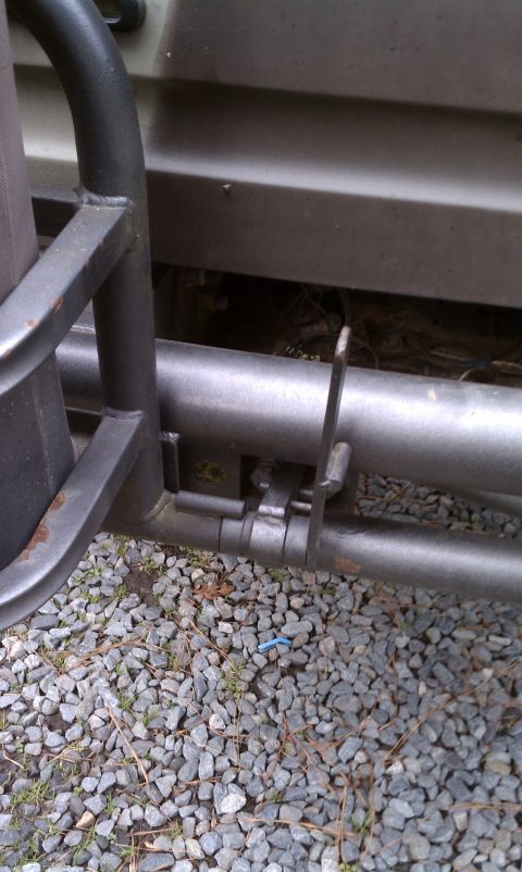 1979 Ford Bronco - Close-up view of the rear bumper and tire rack assembly on a vehicle.