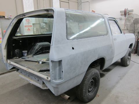 1987 Dodge 1500 - Dodge Ramcharger undergoing bodywork, showing primer and preparation for paint.