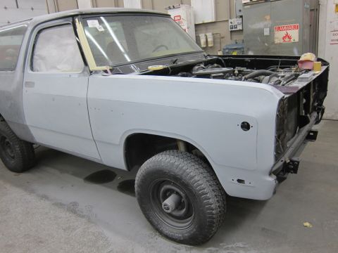 1987 Dodge 1500 - This Dodge Ramcharger is undergoing bodywork, with its hood removed to access the engine bay.