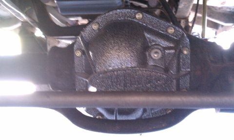 1979 Ford Bronco - The textured cover on the rear differential is visible from underneath the vehicle.