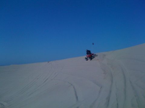 2005 Dodge 1500 - ATV riding on a sand dune.