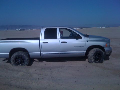 2005 Dodge 1500 - Silver 2005 Dodge 1500 pickup truck stuck in sand dunes.