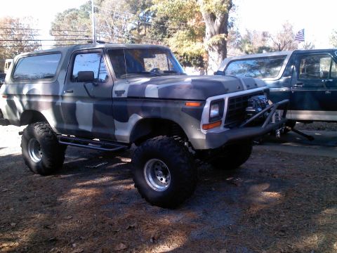 1979 Ford Bronco - This lifted Ford Bronco is painted in a camouflage pattern and features oversized off-road tires.