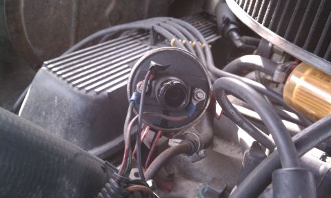 1979 Ford Bronco - Close-up view of an engine's distributor cap and associated wiring.