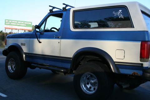 1982 Ford Bronco - This Ford Bronco has a two-tone paint job and a skull decal on the rear window.