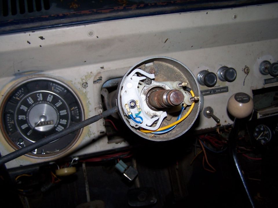 1973 Ford Bronco interior showing steering column wiring and dashboard gauges