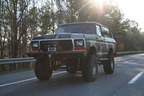1982 Ford Bronco - This modified Ford Bronco features a lifted suspension and off-road tires, ready for adventure.