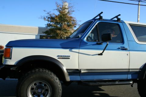 1982 Ford Bronco - This Ford Bronco features a two-tone paint scheme and a roof rack for extra storage.