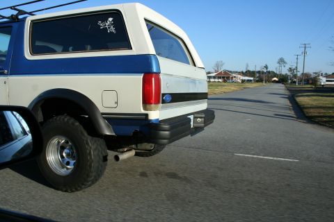 1982 Ford Bronco - This Ford Bronco has a distinctive two-tone paint scheme and a skull decal on the rear passenger window.