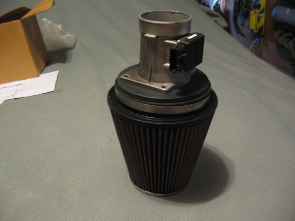 Mass air flow sensor attached to a conical air filter