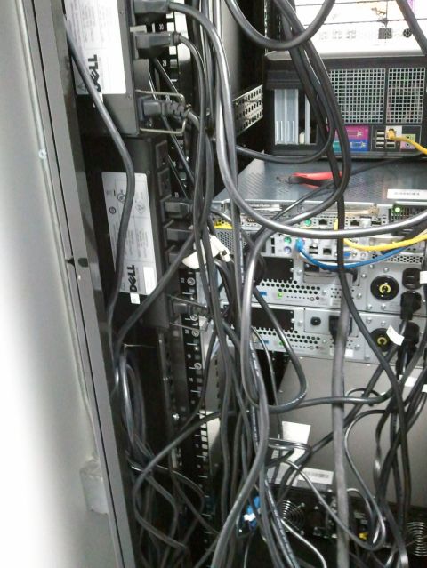 1985 Ford F-150 - A server rack filled with tangled cables and various electronic components, including Dell power strips.