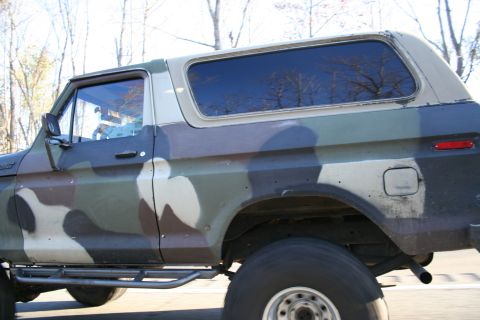 1982 Ford Bronco - This Ford Bronco features a distinctive camouflage paint job and aftermarket running boards.