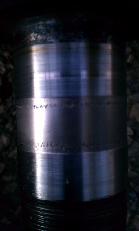 1993 Ford Bronco - A close-up view of a worn differential part, showing significant scoring and pitting indicative of heavy use.