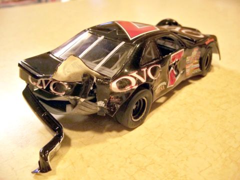 1971 Ford Ranchero - This toy race car has significant damage to its rear end, including a bent frame.