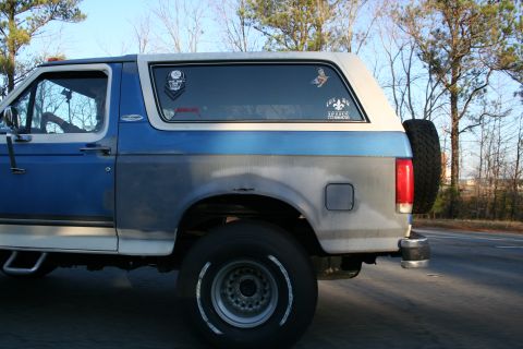 1982 Ford Bronco - This Ford Bronco has a two-tone paint job and a spare tire mounted externally on the rear.
