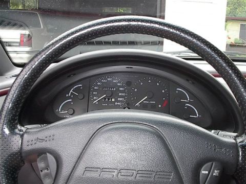 1993 Ford Probe - Interior view of a 1993 Ford Probe, showing the dashboard and steering wheel with 'PROBE' branding.