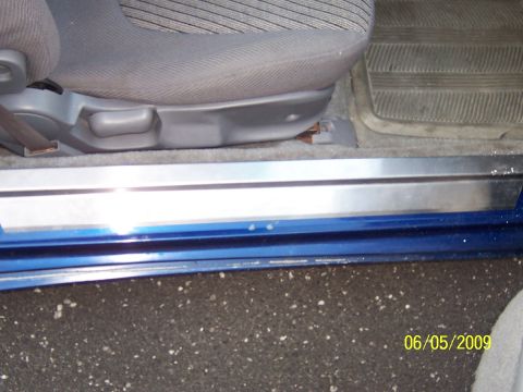 1993 Ford Probe - Interior view of a car's door sill and seat base.