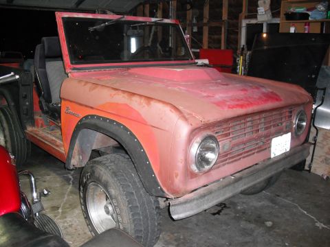 1968 Ford Bronco - This 1968 Ford Bronco is in a garage, showing its front end and driver's side.