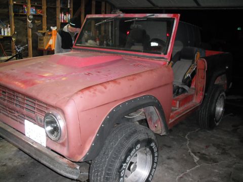 1968 Ford Bronco - This 1968 Ford Bronco is seen in a garage, appearing to be in a state of restoration or repair.