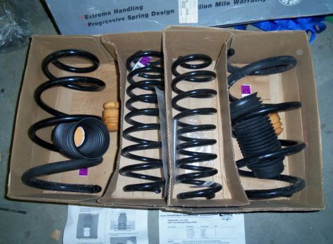 2000 Mercury Grand Marquis - New suspension parts are laid out in their original packaging, ready for installation.