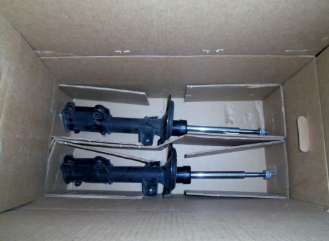 2000 Mercury Grand Marquis - A pair of car shock absorbers are shown inside their shipping box.