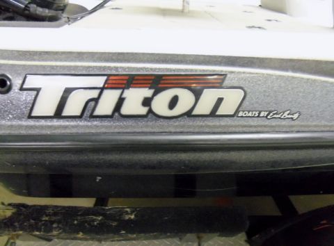 2000 Mercury Grand Marquis - Close-up of a boat's side, showing the Triton branding and manufacturer information.