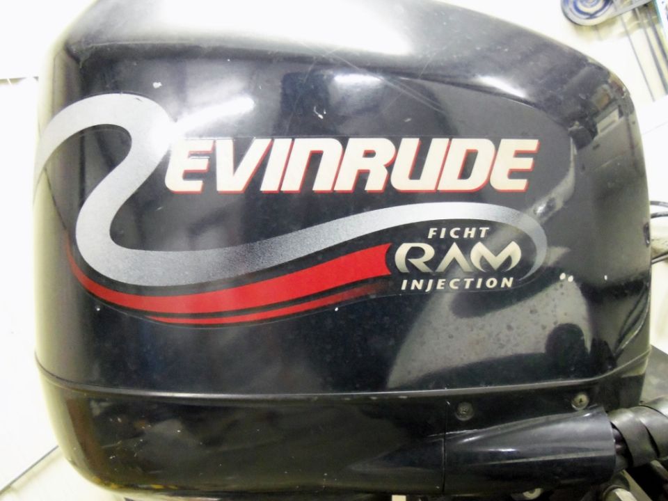 Black Evinrude outboard motor with red and silver graphics