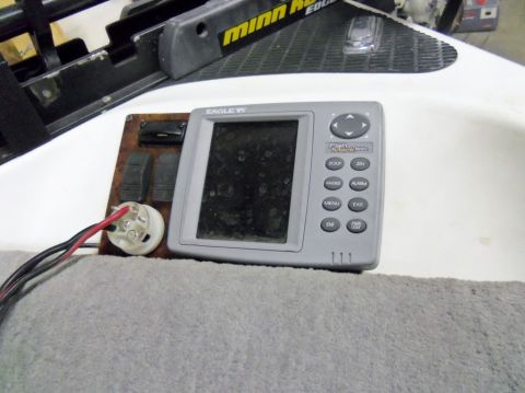 2000 Mercury Grand Marquis - Close-up of a fish finder and part of a trolling motor mount, likely on a boat.