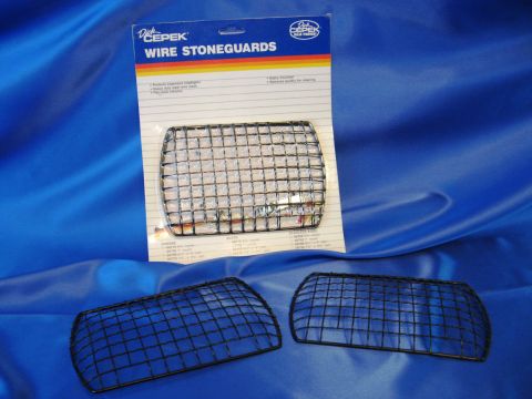 1986 Ford Bronco - Dick Cepek wire stone guards are shown for sale on a blue satin cloth.