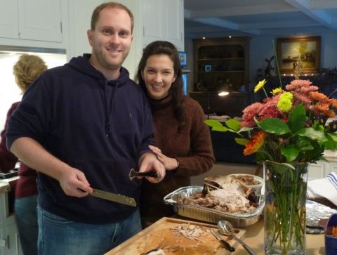1996 Ford Bronco - A couple prepares to carve a Thanksgiving turkey in a home setting.