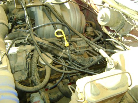 1968 Ford Mustang - Close-up view of a vehicle's engine bay, showing various components and wiring.
