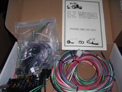 1968 Ford Bronco - E-Z Wiring kit includes fuse box, bundled wires, and an instruction sheet with phone number.