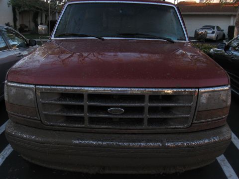 1995 Ford F-150 - Front view of a 1995 Ford F-150, coated in dirt after offroading.