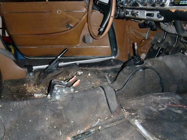 Interior of a 1969 Volvo P1800 showing dashboard and floor