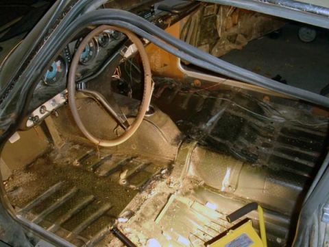 1969 Volvo P1800 - The interior of a 1969 Volvo P1800 appears to be undergoing restoration or repair.