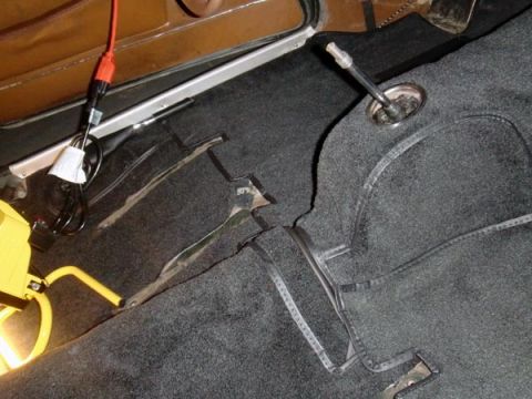 1969 Volvo P1800 - Interior view of a 1969 Volvo P1800, highlighting the carpet and gear shifter area.