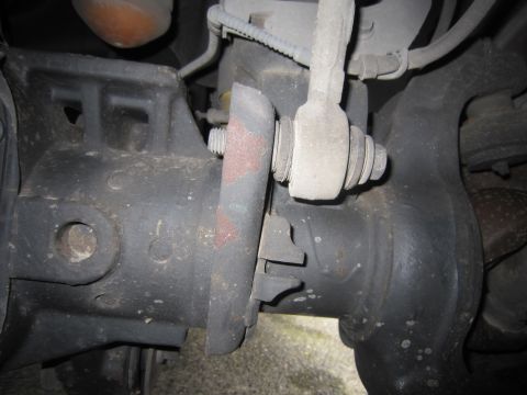 2008 Ford F-450 - A detailed view of a vehicle's suspension system, focusing on the linkage and bracket assembly.